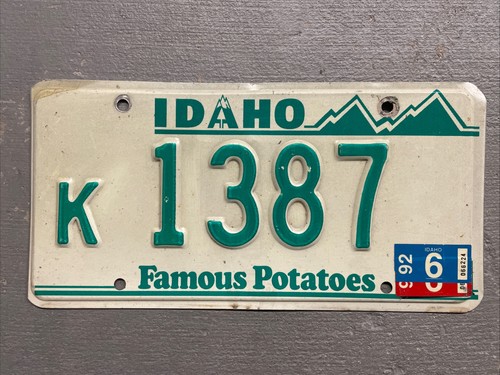 VINTAGE IDAHO LICENSE PLATE FAMOUS POTATOES WHITE/GREEN RANDOM LETTERS/NUMBERS