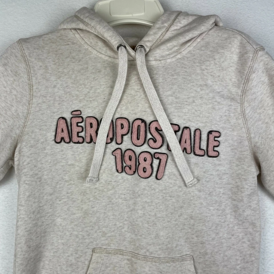 Suéter con Capucha Aéropostale Para Mujer Pequeño Color Crema Bolsillo Pullover Foto 3 de 4