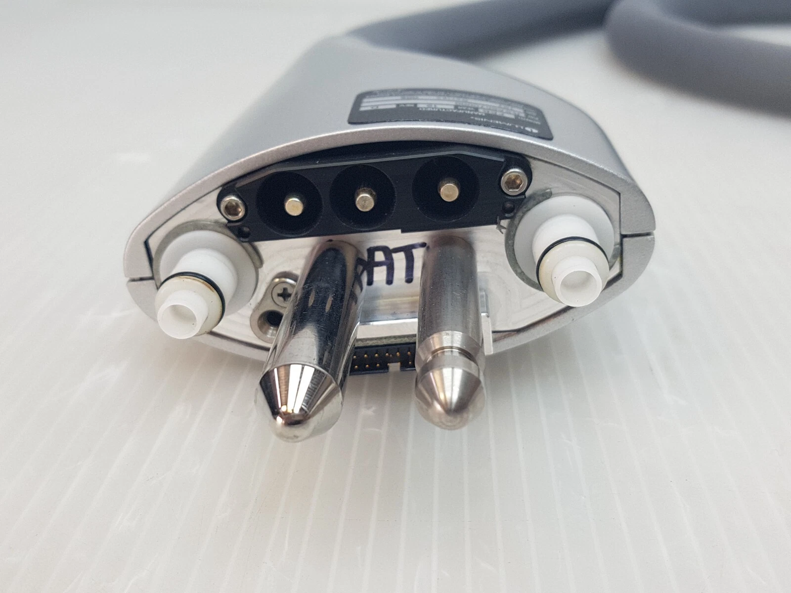 Connector end: 3-pin power connector, two metal pins and white fluid fittings