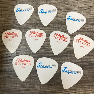 10 NOS   Hofner Strap It On Thin Guitar Picks 20 Years Old some Aging