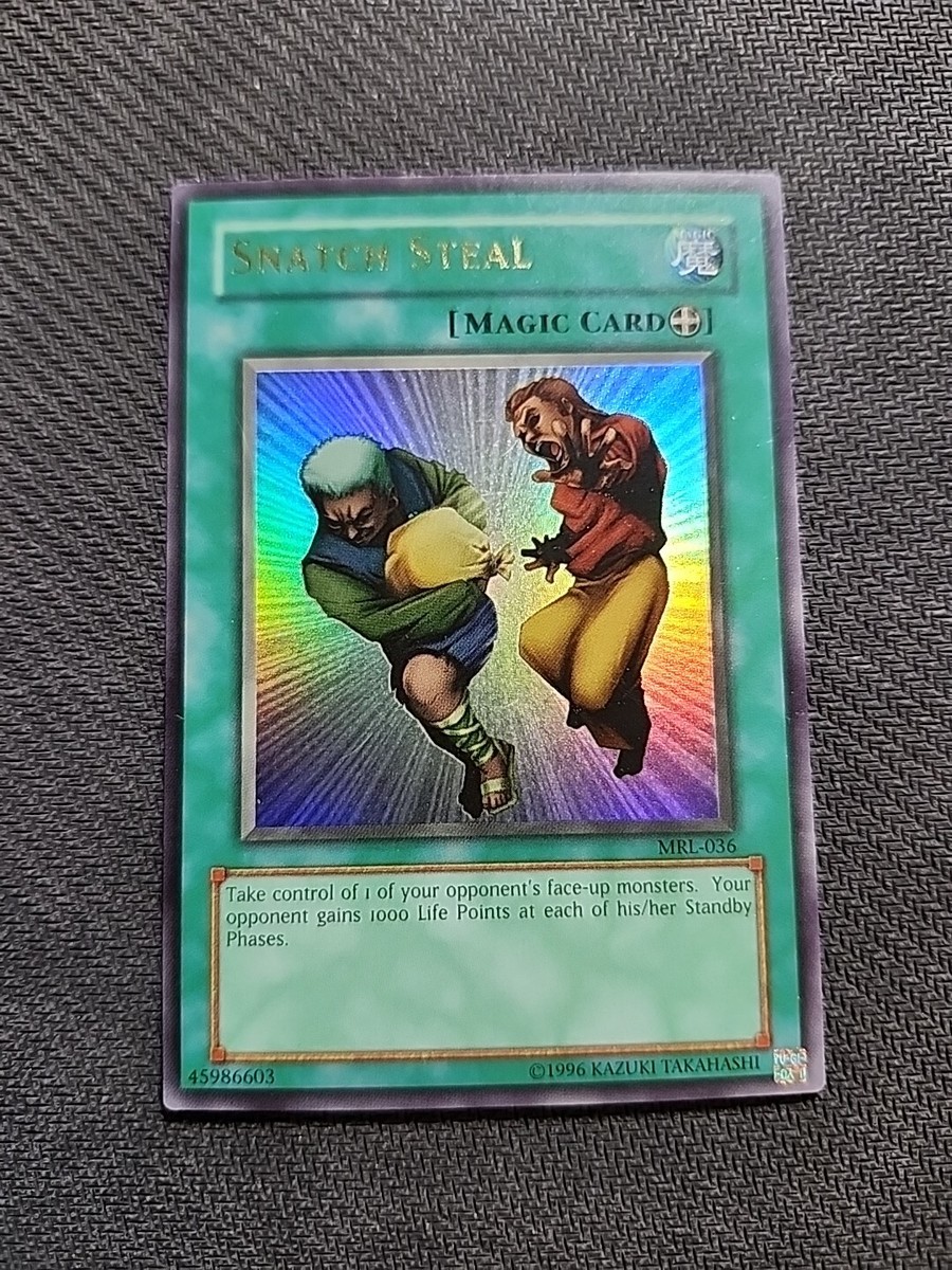 yugioh cards that steal monsters Amazon.com: Yu-Gi-Oh! - Snatch Steal (SD2-EN013) - Structure Deck 2: Zombie  Madness - Unlimited Edition main image 1