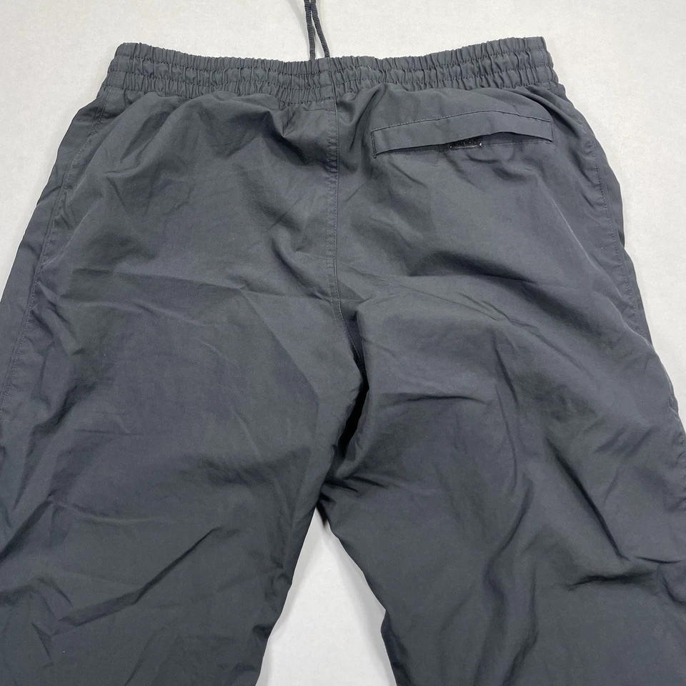 Pantalones cortavientos Nike de colección para hombre M pantalón de pista bolsillo negro atlético naranja etiqueta Foto 4 de 4