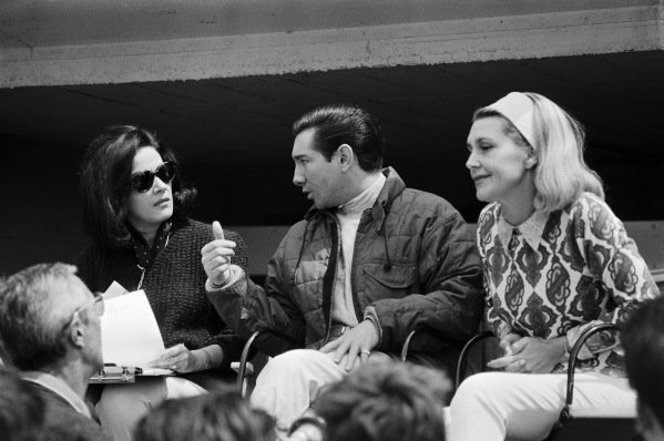 Pedro Rodriguez and wife in the 1964 Le Mans pits vintage photo