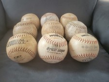 9 used white 12" softballs great for practice