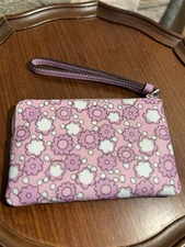 Coach Corner Zip Wristlet with a floral print in the color Sv/Lily Multi NWT