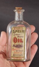 Antique Sperm Oil, Sewing Machines, Bicycles Glass Bottle & Whale Paper Label 