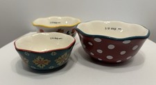 Pioneer Woman Nested Measuring Cups Three-Piece Set. 1/2, 1/3, 1/4.