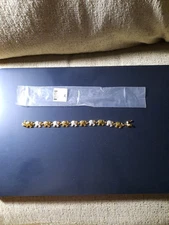 JTV#DOE138-75.Round whit diam. accent 14Kyellowgold over brass elephant bracelet