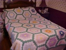 VINTAGE HAND PIECED QUILT, FLOWER GARDEN, GRN PATH, MULTICOLORED FEEDSACK