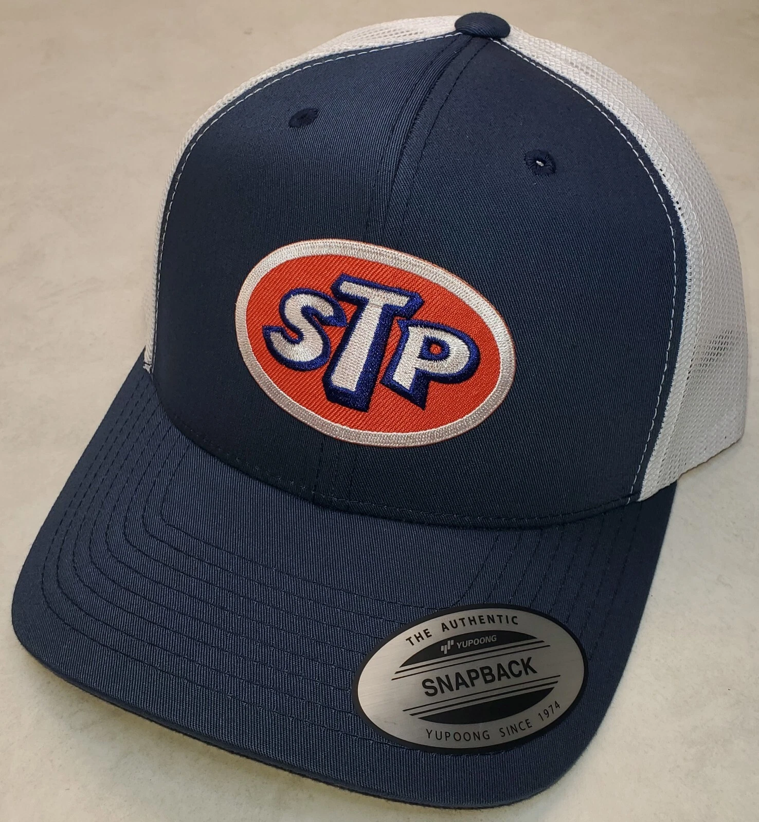 STP OIL Patch Trucker Hat/YP Classic 6606 PreCurved Snapback Navy/White