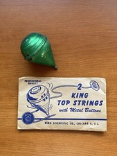 Vintage Siren King Green Metal Spinning Top Toy w Sealed Packet Strings