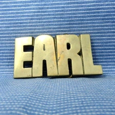 EARL Belt Buckle Iconic 80s Cut Out Brass Name Vintage Baron Taiwan      .GTA292