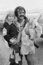 Sonny Bono carrying his daughter Chastity Bono with an unspecified- Old Photo