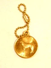 older gold colored Wolfschmidt's Vodka advertising key fob and chain
