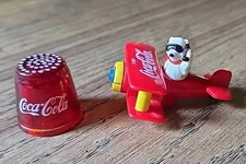 Lot of 2 Vintage Coca Cola Trinkets: Glass Thimble & Bi Plane w/Polar Bear Pilot