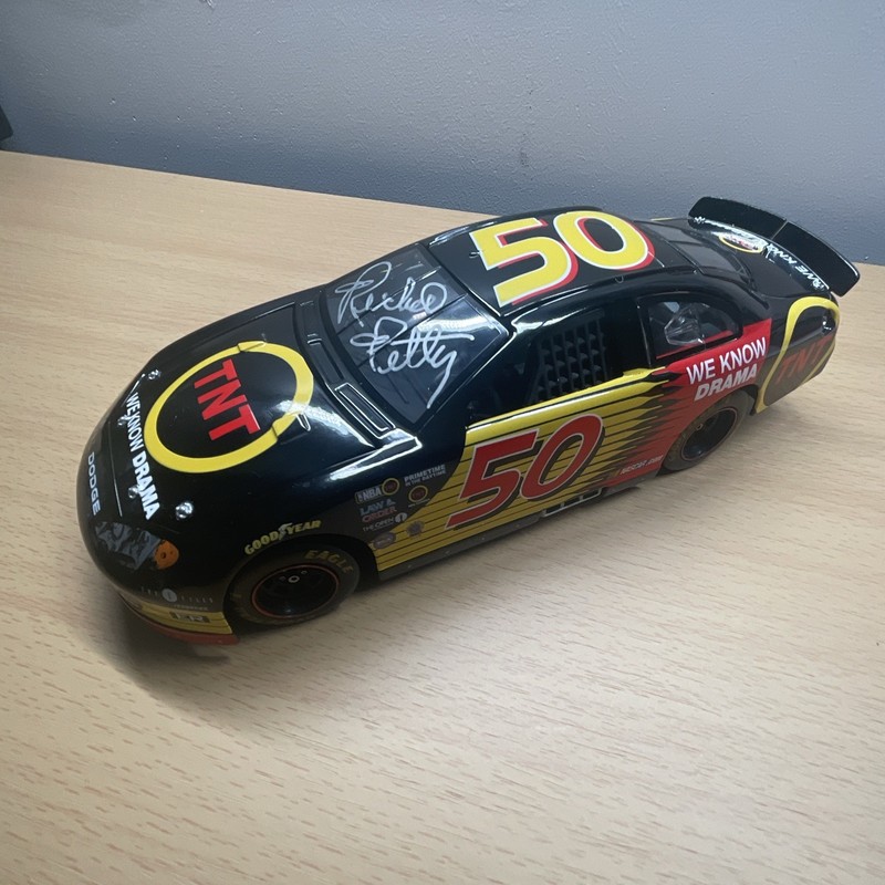 Richard Petty #50 TNT We Know Drama Dodge Diecast Autographed Black Red Yellow