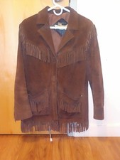 Vintage 1960's brown genuine leather jacket with fringe all around the jacket.