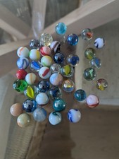Collection of 40 old vintage colourful marbles all sizes.