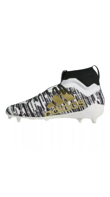 gold and black adidas cleats