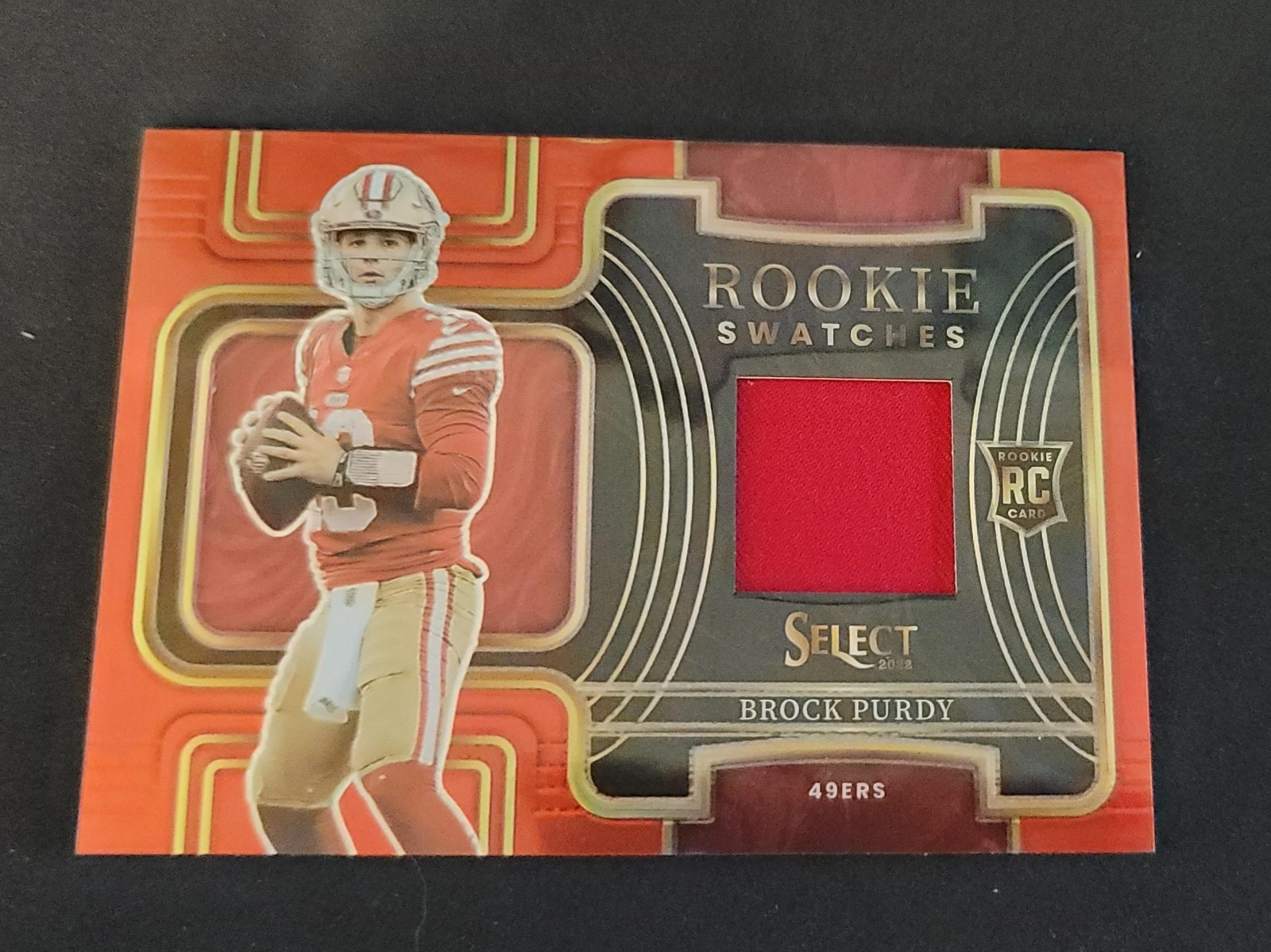 Brock Purdy 2022 Panini Select #RSW-17 Red Prizm Rookie Swatches