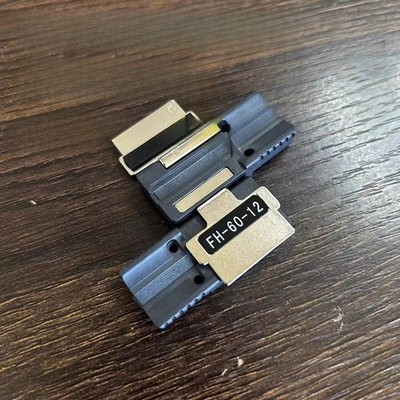 Single-core ribbon 12-core fiber optic fixture, no fiber running