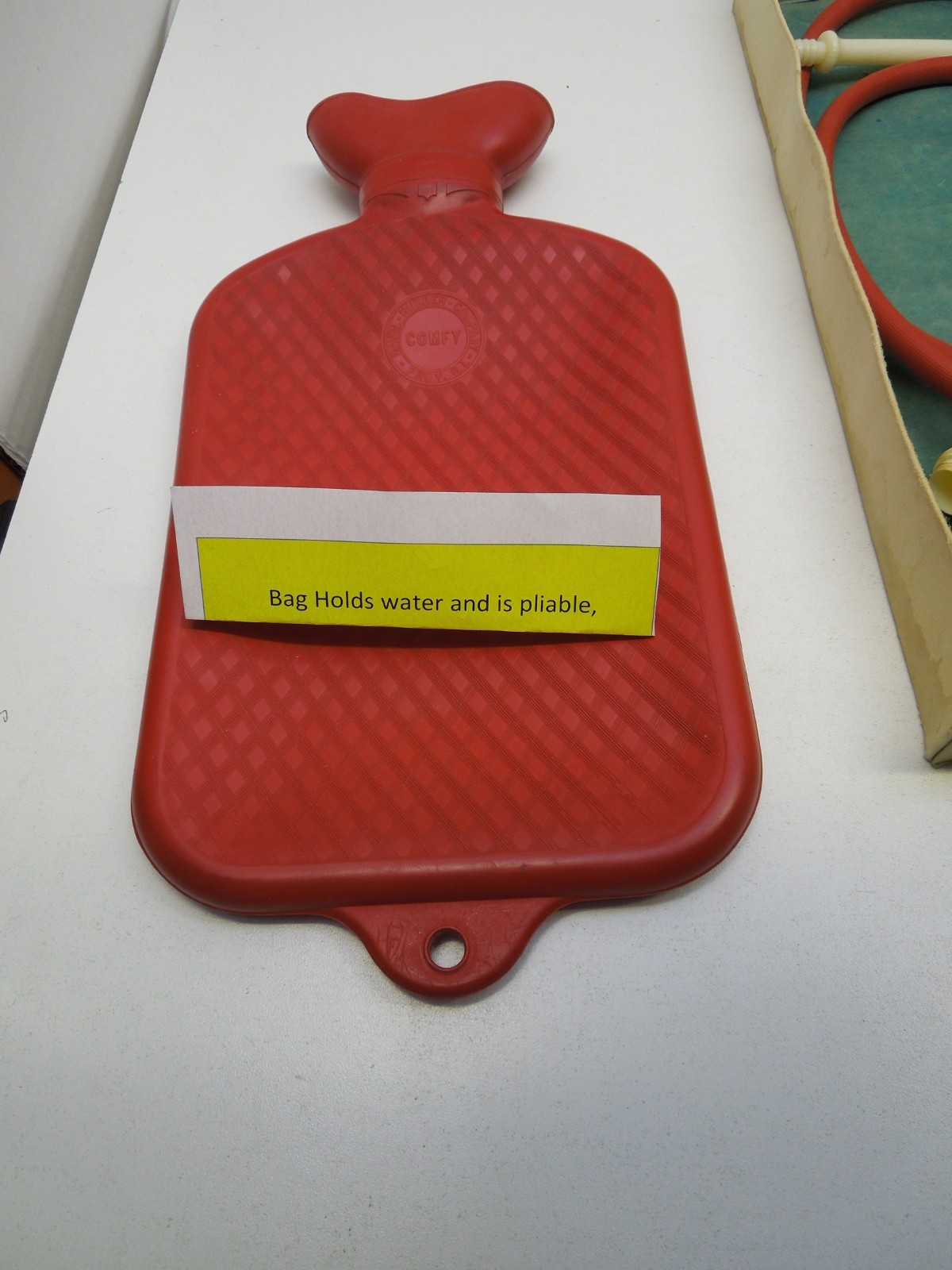 A PAIR of VINTAGE DAVOL COMFY WATER BOTTLE/SYRINGE COMBINATION #12