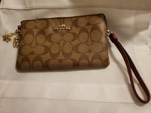 coach wristlet with charms