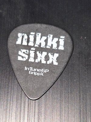 MOTLEY CRUE NIKKI SIXX Fick Dick guitar pick used at a live show