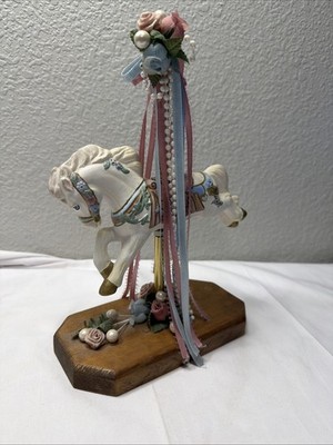 Decorative ceramic carousel horse figurine with floral accents On Wood Base