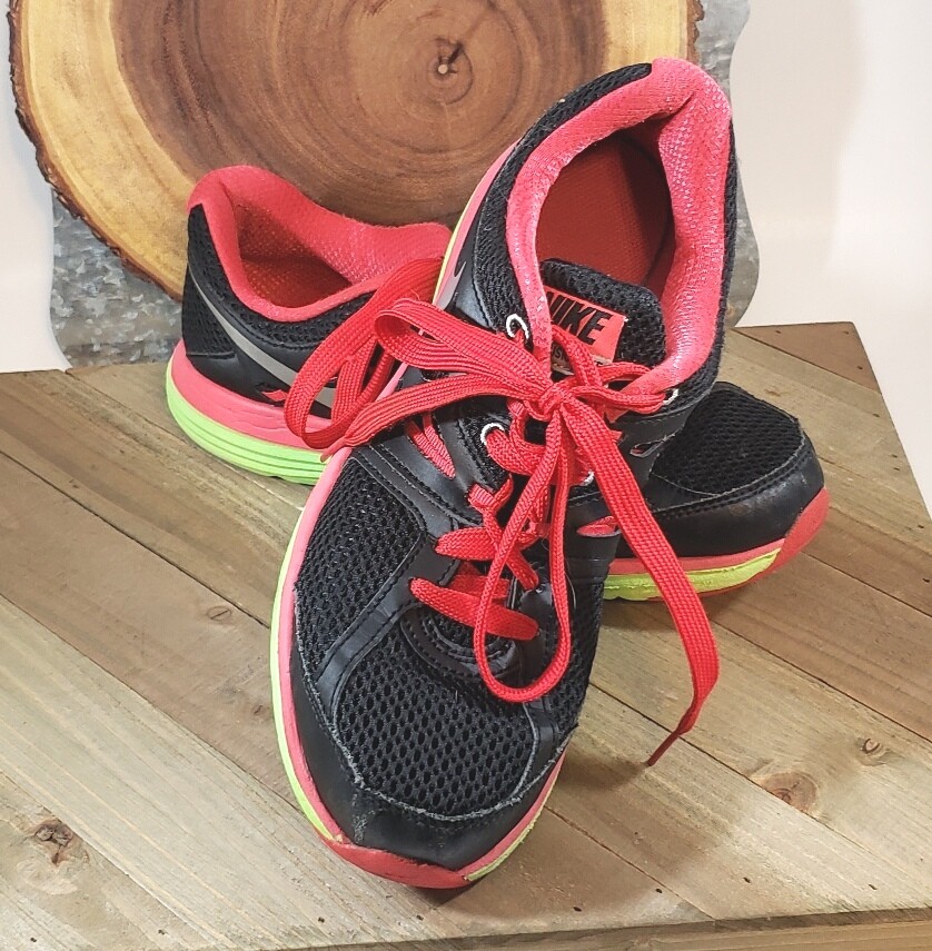 red black and green tennis shoes