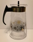 Pyrex 10 cup glass coffee carafe with gold snowflake design and lid