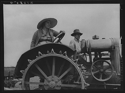 Photo:Fairfield Bench Farms Montana 1939 Farmer and Wife on Tractor