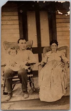 Antique RPPC Postcard Family Seated Porch, Child Father's Lap 1920s
