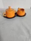 Fiestaware Sugar Bowl with Lid and Creamer On a Tray