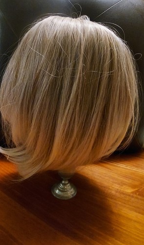 BLOND HAIR WIG. MEDIUM LENGTH.  FEELS LIKE REAL HAIR. NO NAME BRAND ON WIG.