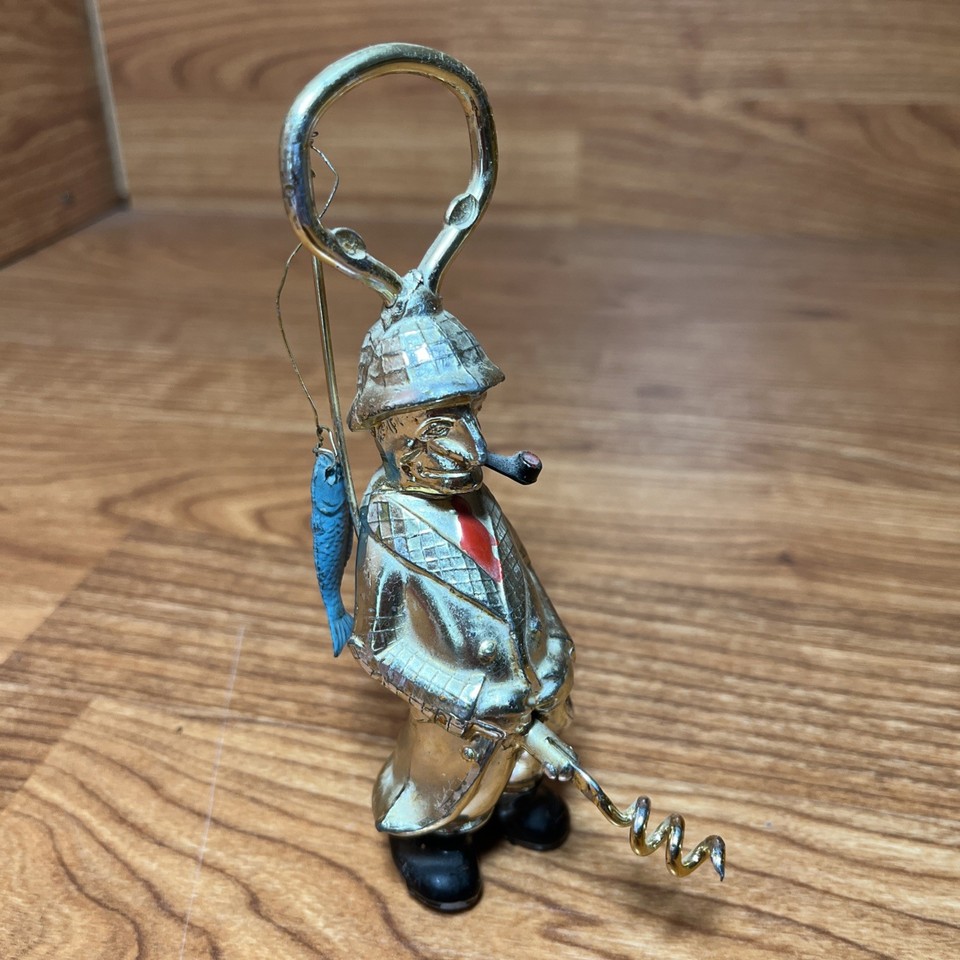Gold-tone MCM fisherman figurine that doubles as a corkscrew and bottle opener — the kind of bar accessory that stops guests mid-sentence.