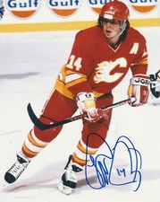 THEO FLEURY SIGNED CALGARY FLAMES 8X10 PHOTO W/PROOF A THEO FLEURY SIGNED CALGARY FLAMES 8X10 PHOTO W/PROOF A
