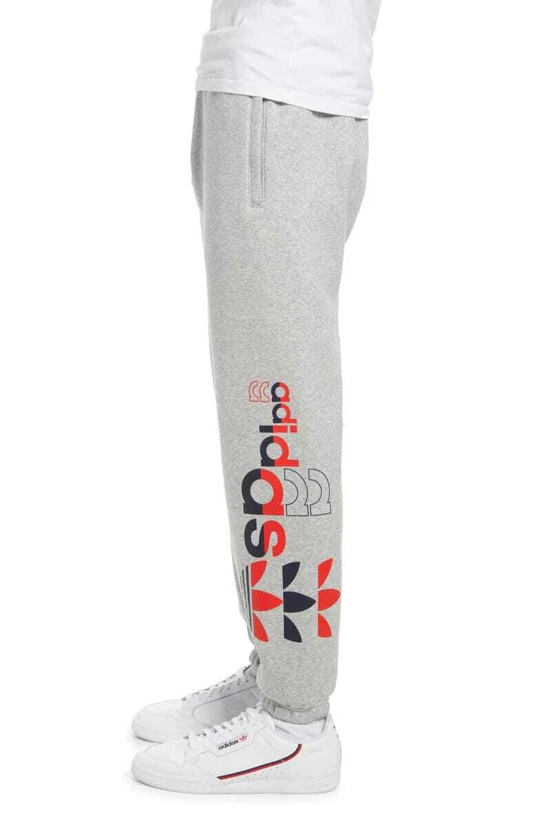 Adidas originals sweatpants with side sale logo