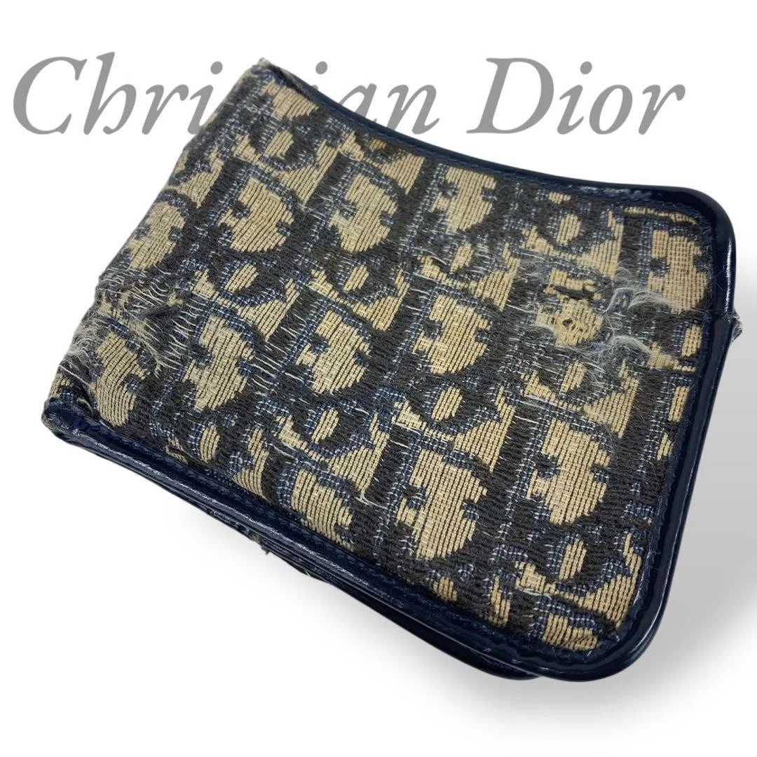 Portefeuille Christian Dior à deux volets motif trotteur partout 