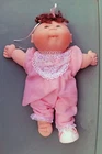 (CP5)  Cabbage Patch Preemie Doll APRIL CELESTE  1984 short brunette tuft hair.