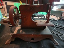 Vintage metal toy sewing machine with flowers