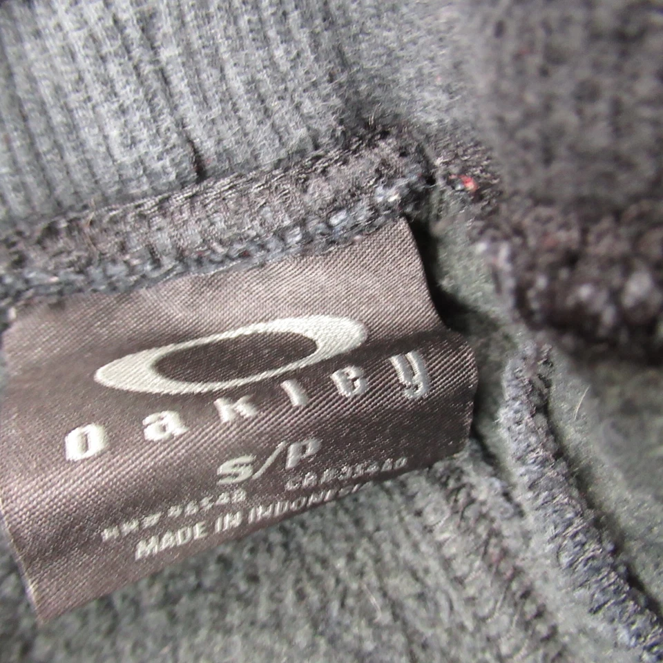 Pantalones Oakley Mujer Pequeños Ligeros Pierna Cónica Exterior Cintura Elástica Negros Foto 3 de 4