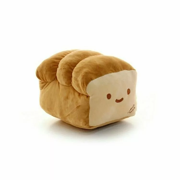 This pillow looks exactly like a loaf of bread and we need it