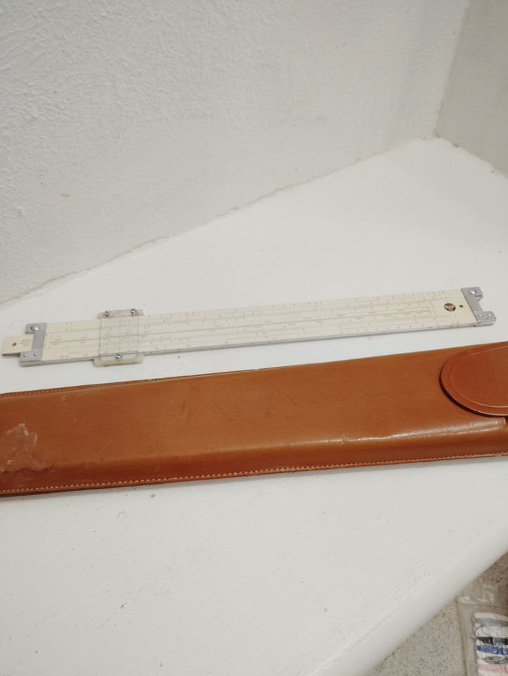 A genuine 1959 Pickett aluminum trig slide rule with original leather case — a beautiful, functional piece of Cold War-era engineering history.