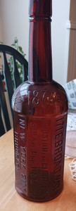 I. Goldberg 8 sided Amber Embossed Bottle