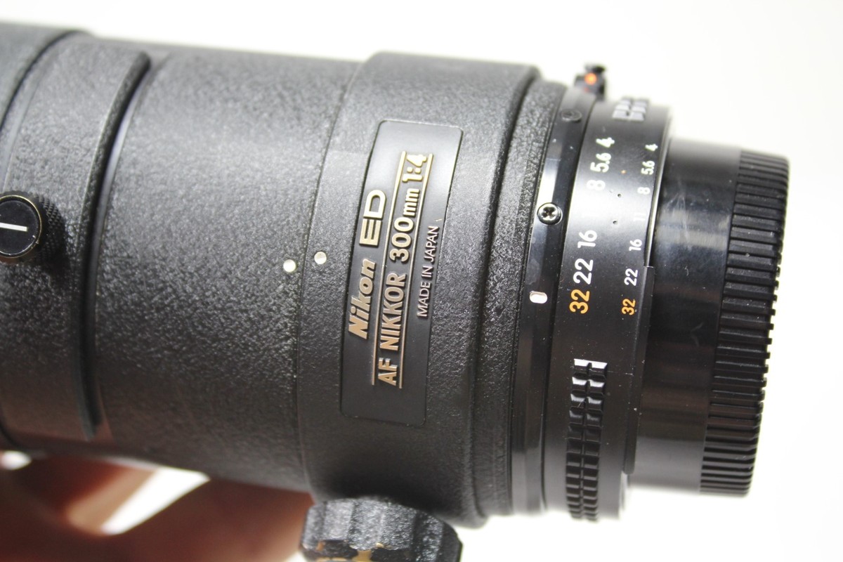 Nikon Nikkor ED 300mm F4 lens + hood auto focus 1:4 E Nikon Nikkor ED 300mm F4 lens + hood auto focus 1:4 E