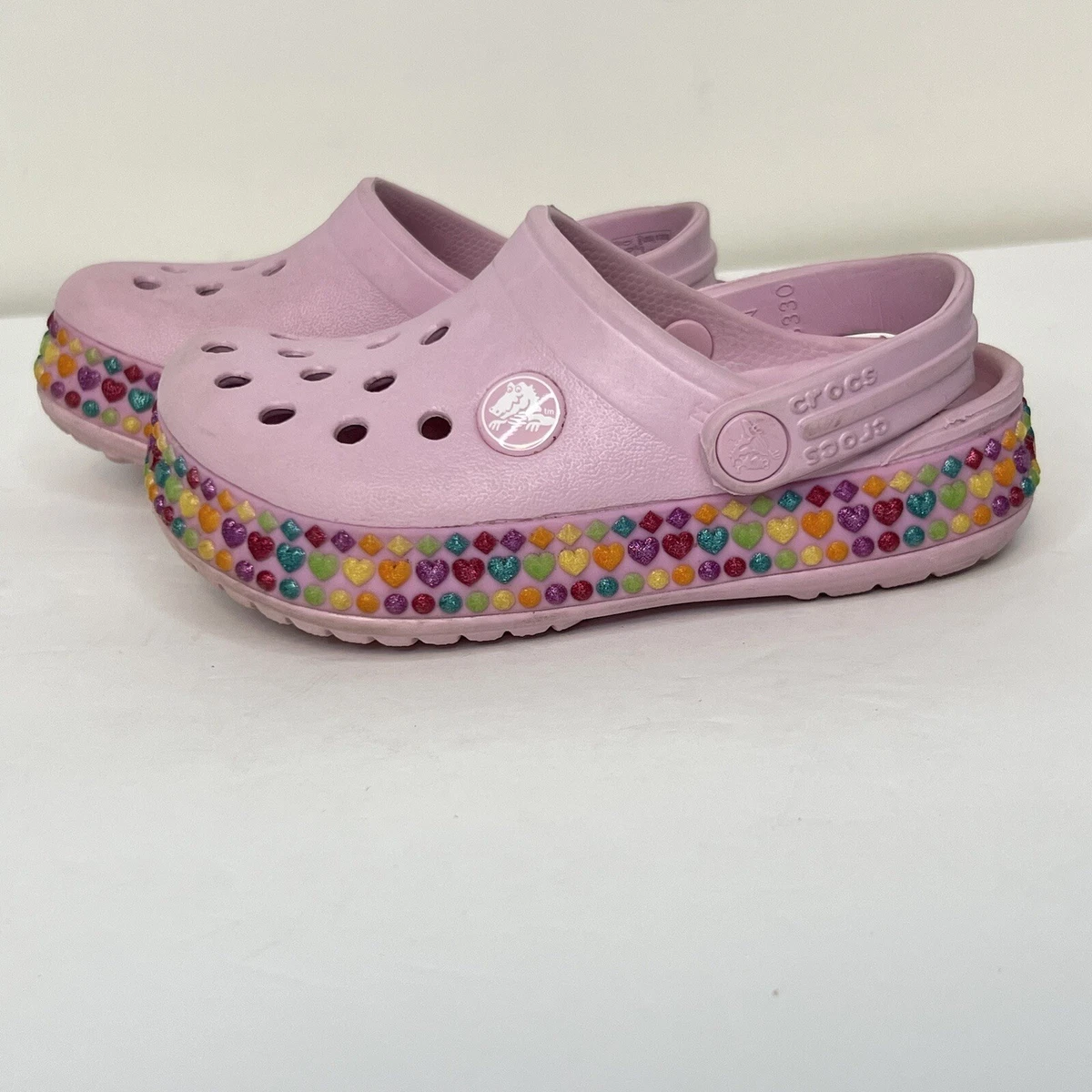 Pink top rainbow crocs
