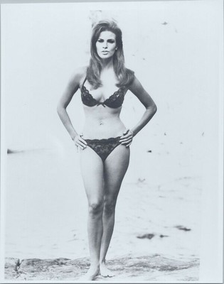 Raquel Welch full length in black bra and panties hands on hips 8x10 photo