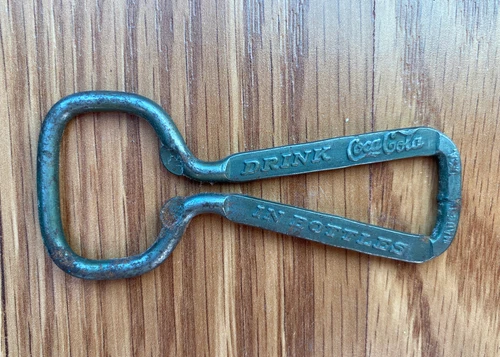 Vintage Hand Coca-Cola Bottle Opener Drink Coca-Cola In Bottles Aged Old Antique