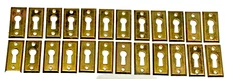 25 Antique Brass Keyhole Covers Escutcheons Skeleton Key NOS New Old Stock Bevel
